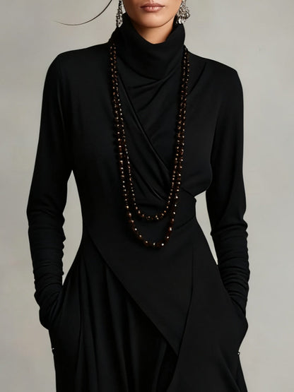 VESTIDO MAXI PLISADO ASIMÉTRICO DE CUELLO ALTO AURELIA