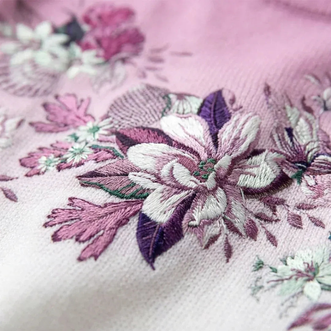 SUÉTER FLORAL CON CUELLO SUAVE